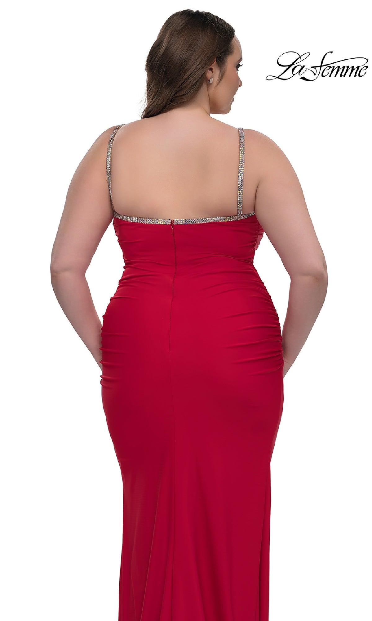 A woman in a fitted red Plus-Size Long Prom Dress: La Femme 32992 with jeweled straps is shown from the back. The bead-trimmed long dress features a straight neckline, and the La Femme logo appears in the top right corner.
